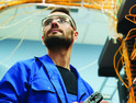 Person working with internet equipment in server room